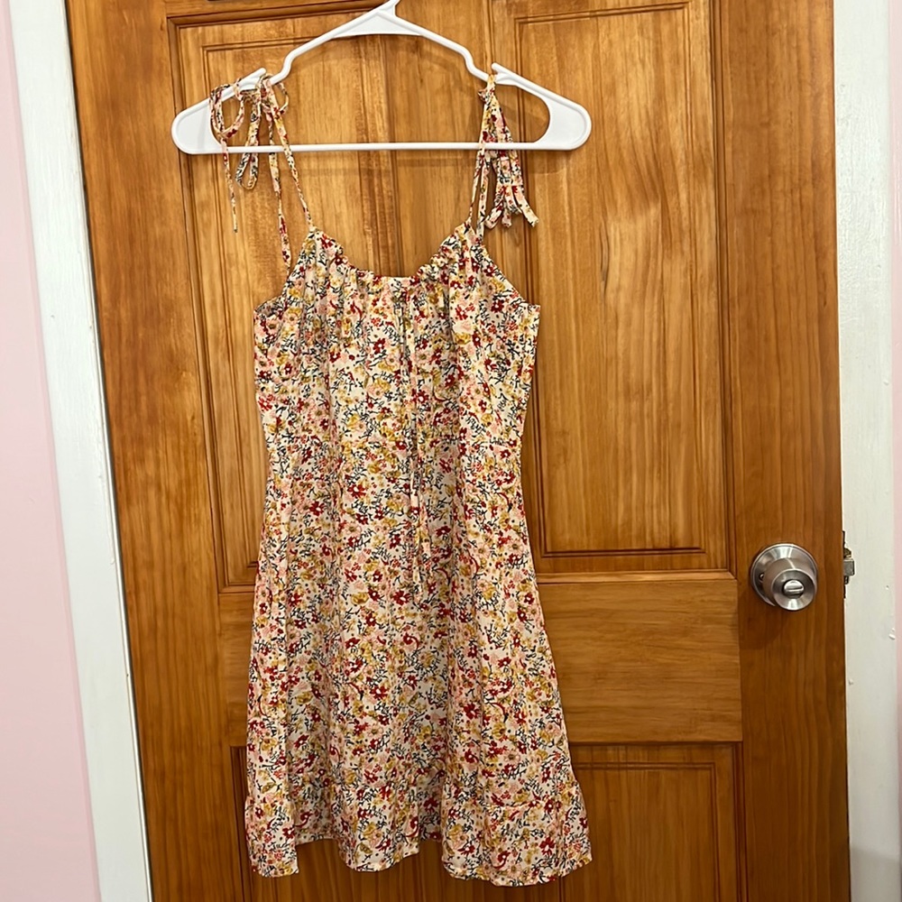 Super colorful, girly and very flattering dress in a size small.